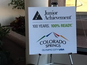 A sign celebrating Junior Achievement at 100 years and being 100% ready